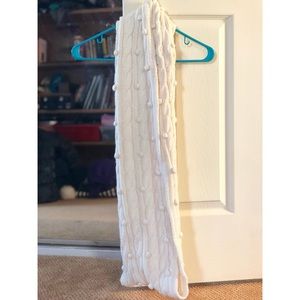 CREAM INFINITY SCARF WITH POMPOMS